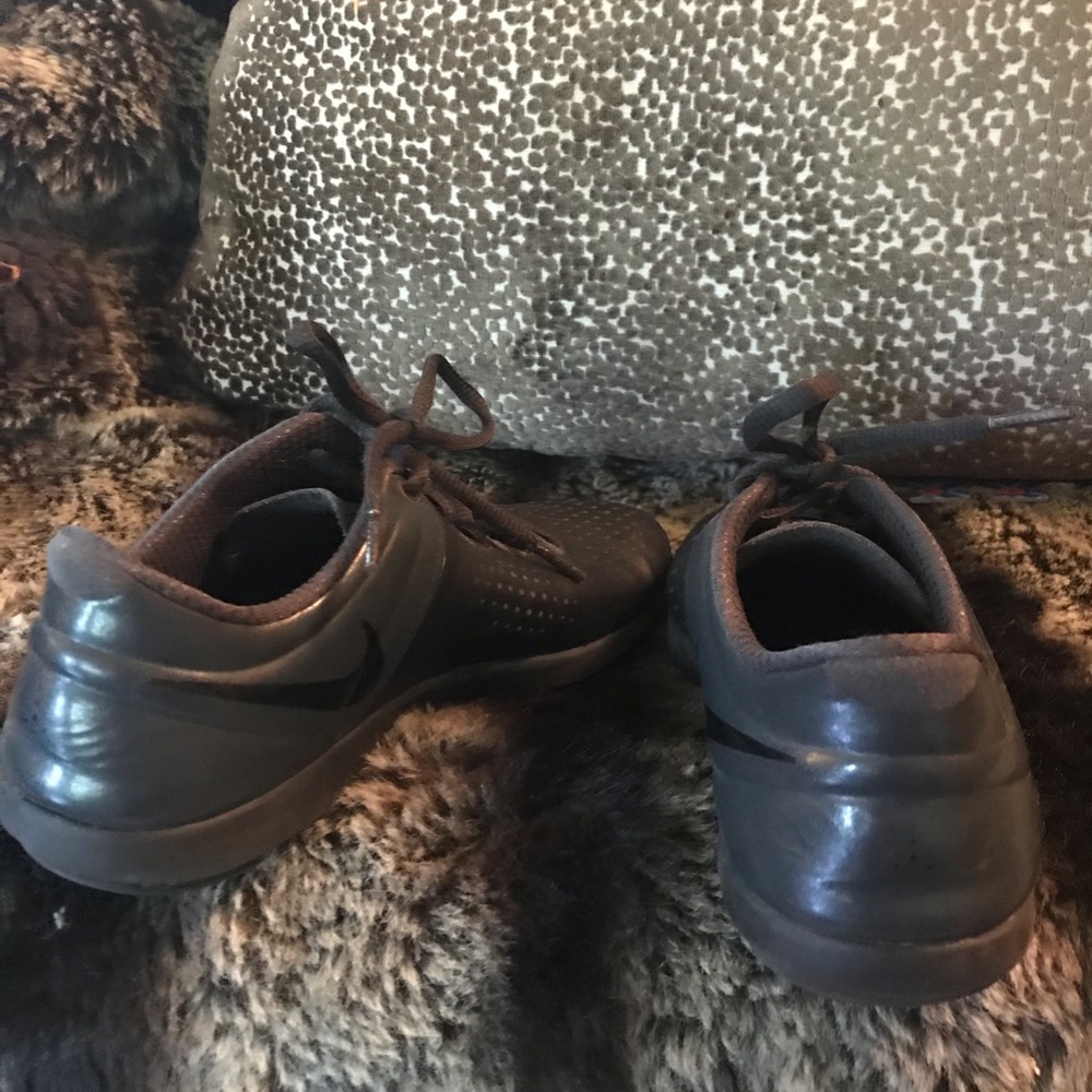 Black NIKE athletic shoes